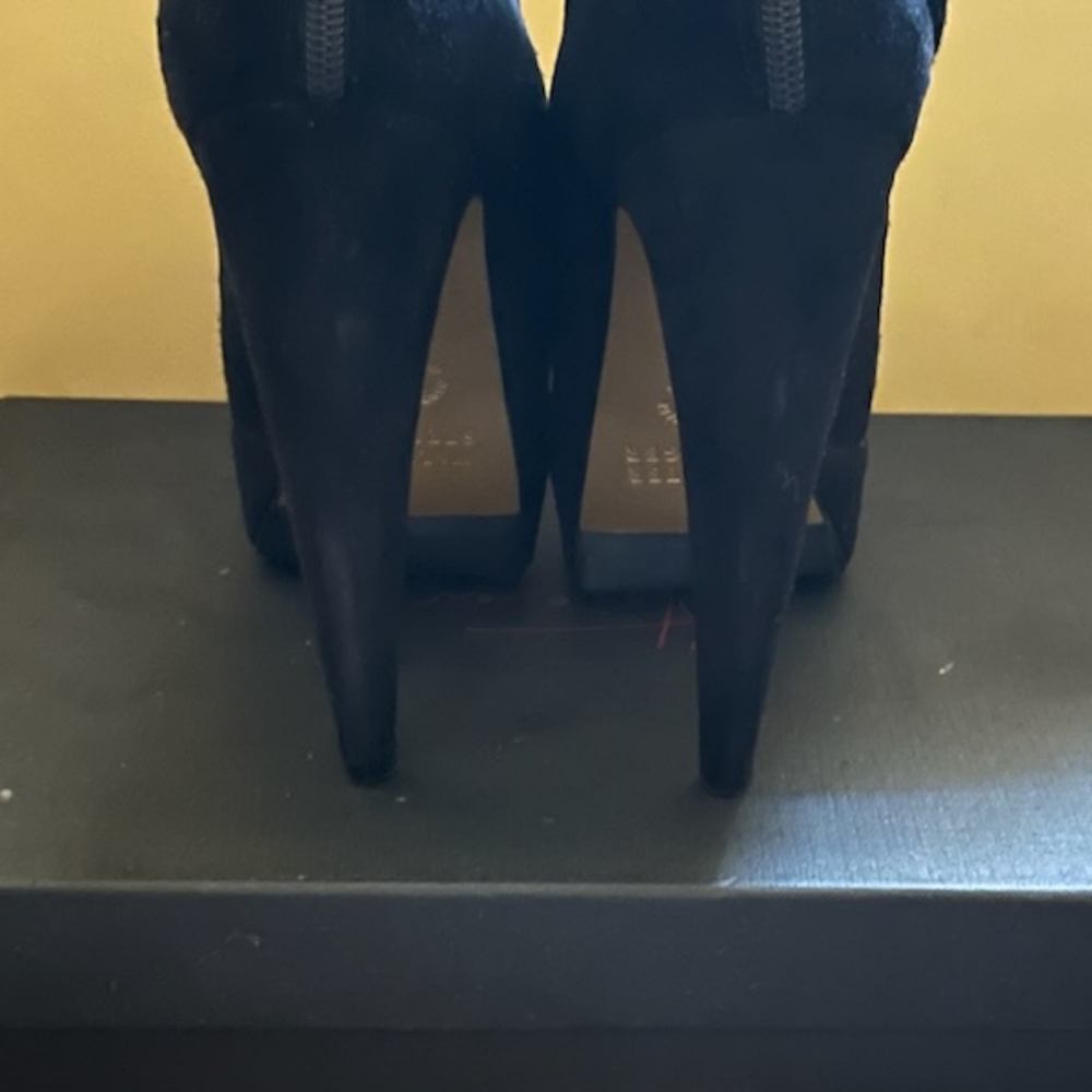 Walter Steiger curved  heel platform bootie.